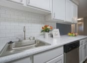 Thumbnail 5 of 39 - Novela Apartments Kitchen sink and subway tile