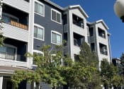 Thumbnail 1 of 20 - a row of houses with trees in front of them