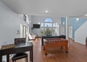 Thumbnail 25 of 34 - an open living room with a pool table in the middle