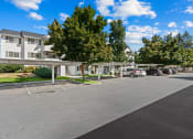 Thumbnail 26 of 32 - Farr Court Parking Lot with Covered Spots
