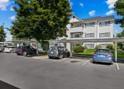 Thumbnail 27 of 32 - Farr Court Parking Lot with Covered Spots
