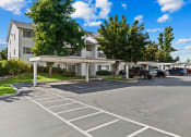 Thumbnail 28 of 32 - Farr Court Parking Lot with Covered Spots