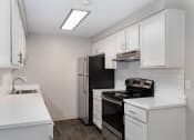 Thumbnail 25 of 39 - Novela Apartments Kitchen Counters and Appliances