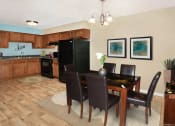 Thumbnail 3 of 5 - a dining room and kitchen with a table and chairs