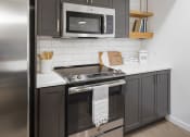 Thumbnail 11 of 33 - kitchen with oven
