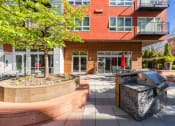 Thumbnail 9 of 22 - Exterior and Patio with BBQ's at Koi Apartments, Seattle, 98107