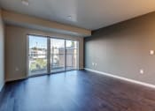 Thumbnail 19 of 22 - Living Room with Private Patio at Koi Apartments, Seattle