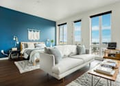 Thumbnail 3 of 20 - a bedroom with a large bed and a large window