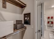 Thumbnail 13 of 39 - Lux Apartments Bellevue WA walk-in closet in the bathroom includes a built-in wall safe in all homes