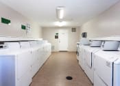 Thumbnail 6 of 24 - Maple Ridge Apartments Laundry Facility