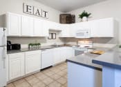 Thumbnail 4 of 24 - Maple Ridge Apartments Clubhouse Kitchen