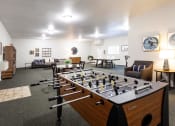 Thumbnail 3 of 24 - Maple Ridge Apartments Clubhouse Lounge with Games