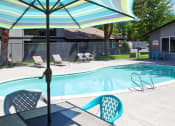 Thumbnail 7 of 24 - Maple Ridge Apartments Pool with Lounge Chairs