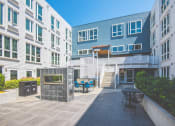 Thumbnail 31 of 49 - Meetinghouse Apartments Outdoor Courtyard and Firepit