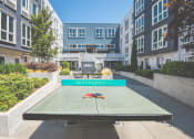 Thumbnail 33 of 49 - Meetinghouse Apartments Outdoor Courtyard and Ping Pong Table