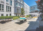 Thumbnail 32 of 49 - Meetinghouse Apartments Outdoor Courtyard and Ping Pong Table