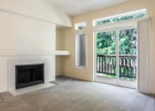 Thumbnail 18 of 39 - Novela Apartment Homes Living Room Fireplace and Balcony