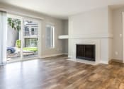 Thumbnail 23 of 39 - Novela Apartment Homes Living Room Fireplace and Patio Door
