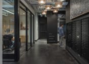 Thumbnail 6 of 33 - a view down the hallway of a large room with lockers and a sign that says f