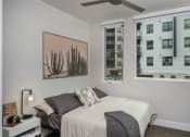 Thumbnail 16 of 33 - a bedroom with a bed and two windows