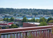 Thumbnail 8 of 21 - a view of a city with a body of water and trees at Wilcox, Seattle, Washington