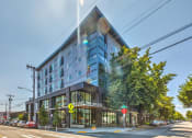 Thumbnail 21 of 21 - a large building on the corner of a city street at Wilcox, Seattle, Washington