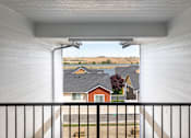Thumbnail 11 of 34 - the view from the upstairs balcony of a house overlooking other houses