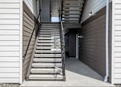 Thumbnail 7 of 34 - a set of stairs leading up to a building with a door