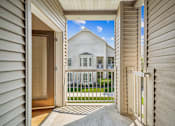 Thumbnail 23 of 47 - A view of a house through a doorway.