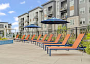 Thumbnail 12 of 35 - The Donovan Apartments in Lee's Summit, Missouri Poolside Patio