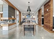 Thumbnail 17 of 35 - the kitchen has a large island with a wooden table and chairs