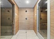 Thumbnail 23 of 35 - a large bathroom with a large shower and a glass door