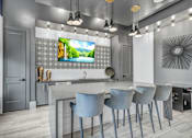 Thumbnail 6 of 43 - A modern kitchen with a large island and chairs.