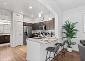 Thumbnail 7 of 92 - Water Oak Apartments in Austin, Texas Model Kitchen