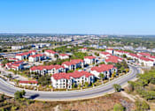 Thumbnail 79 of 92 - A bird's eye view of a residential area with houses and roads.