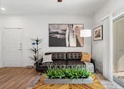 Thumbnail 3 of 92 - Water Oak Apartments in Austin, Texas Model Living Room with Private Patio