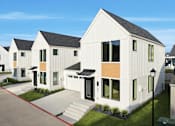 Thumbnail 24 of 63 - A row of modern houses with white exteriors and wooden accents.