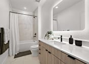 Thumbnail 50 of 63 - A modern bathroom with a white marble shower and a white toilet.