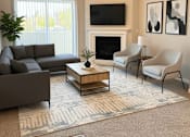 Thumbnail 5 of 10 - A living room with a grey couch, a coffee table, a fireplace, and a television.