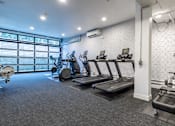 Thumbnail 11 of 29 - the gym is equipped with cardio equipment and weights