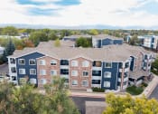 Thumbnail 3 of 20 - an aerial view of a building with blue and red apartments