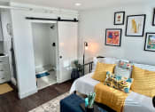 Thumbnail 3 of 6 - The Alegre Model Living Room and Bathroom
