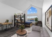 Thumbnail 1 of 10 - an open living room with a couch and a desk and a window