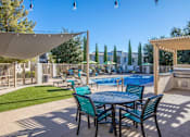 Thumbnail 11 of 14 - Port Royale Luxury Apartment Homes in Sierra Vista, Arizona Pool with Lounge Chairs and BBQ
