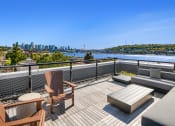 Thumbnail 10 of 23 - a balcony with a view of a city and a river at Liza Apartments, Washington