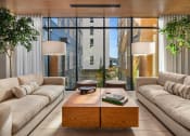 Thumbnail 17 of 23 - a living room with couches and a coffee table at Liza Apartments, Seattle, Washington, 98102