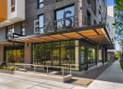 Thumbnail 21 of 23 - the entrance to a building with a large sign on the front of it at Liza Apartments, Seattle, Washington