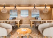 Thumbnail 19 of 23 - a lobby with chairs and tables and a reception desk at Liza Apartments, Washington