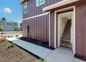 Thumbnail 30 of 30 - the front entrance of a home with stairs and a sidewalk