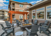 Thumbnail 28 of 45 - RedPoint Apartments Clubhouse Patio with Firepit and BBQ's